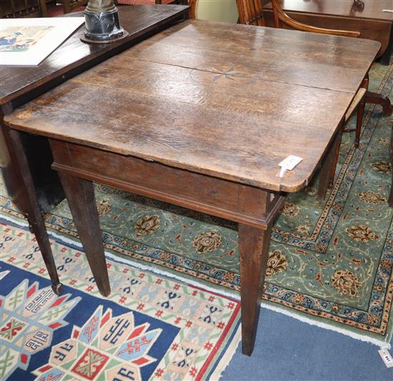 A North European inlaid oak extending dining table W.122cm closed